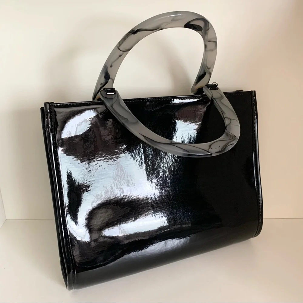 Hold NWOT Neiman Marcus black patent marble handle modern bag